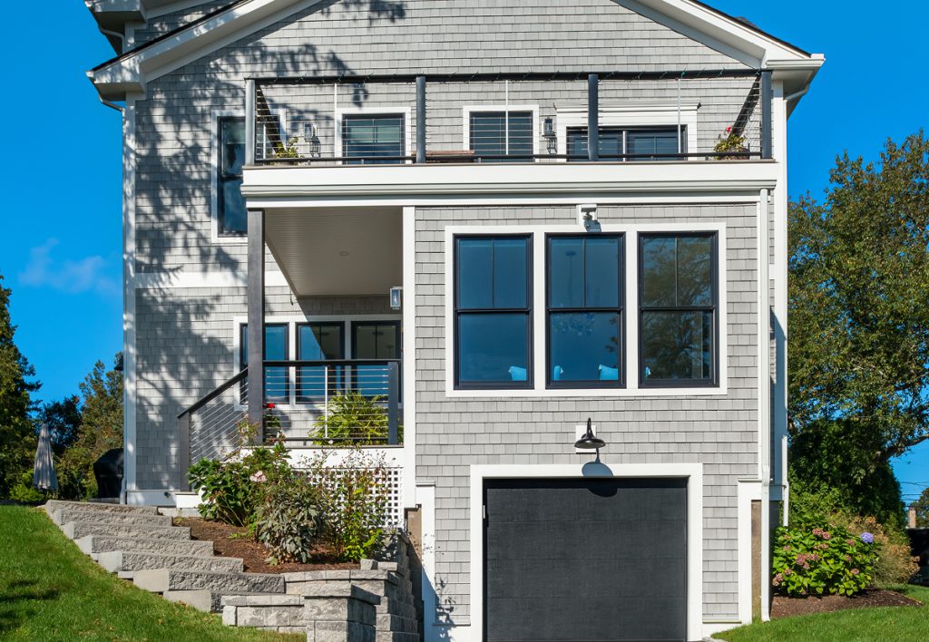 Coastal home clad in Beach House Shake Atlantica composite shingles